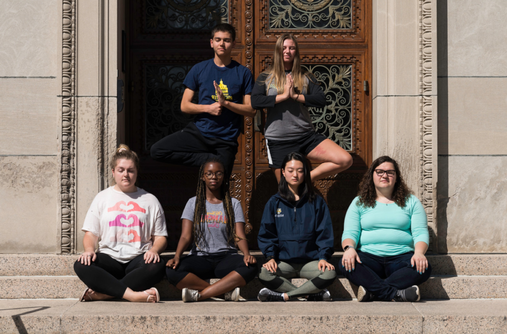 Students meditate on the University of Rochester river campus