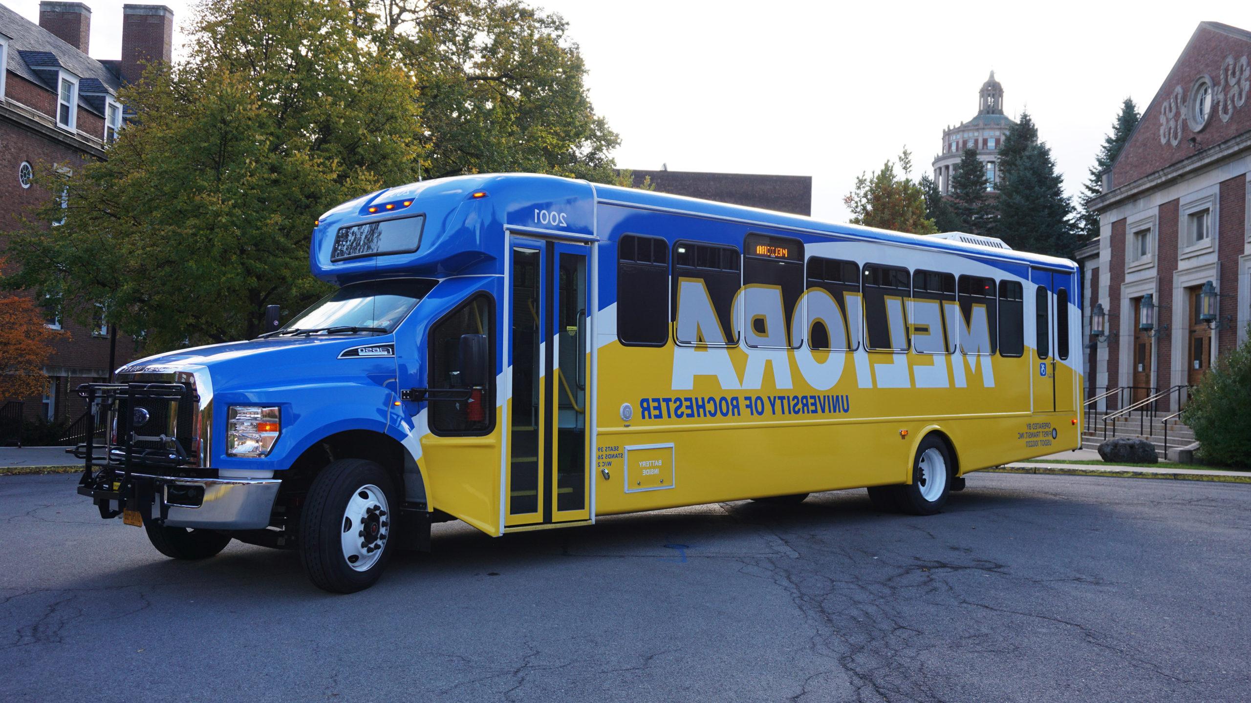 University of Rochester shuttle bus with new blue and yellow wrap